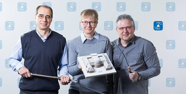 There’ll be no "fishing forays" here – Anatoliy Holinger (ITS NET), Anja Harder (ITS) and Tibor Magoc (ITS BD), from left to right, symbolically protect the ETH model of the Raplab (D-ARCH). A big thank you goes to Daniel Baumann for the ETH scale model.
