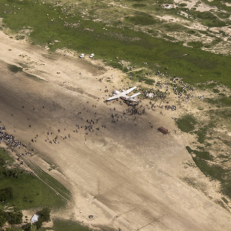 Birdview of a emergency plane with people surrounding it