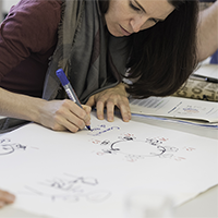 Student drawing a graphic