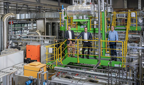 A. Aeschimann and L. Schmidlin from AlphaSYNT and T. Schildhauer from PSI (from left to right) in front of the GanyMeth pilot plant at PSI. In future AlphaSYNT plans to develop this type of plant to convert renewable energy sources such as sewage slurry into biogas and then store the energy in the form of methane gas. (Photo: PSI/Markus Fischer) 