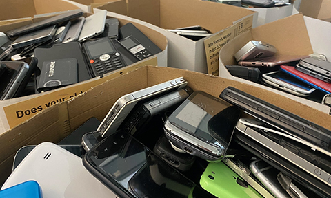 Old mobile phones in a box.